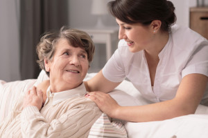 young helpful woman with older woman